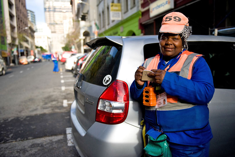 Marshal collecting parking fee in Cape Town, South Africa